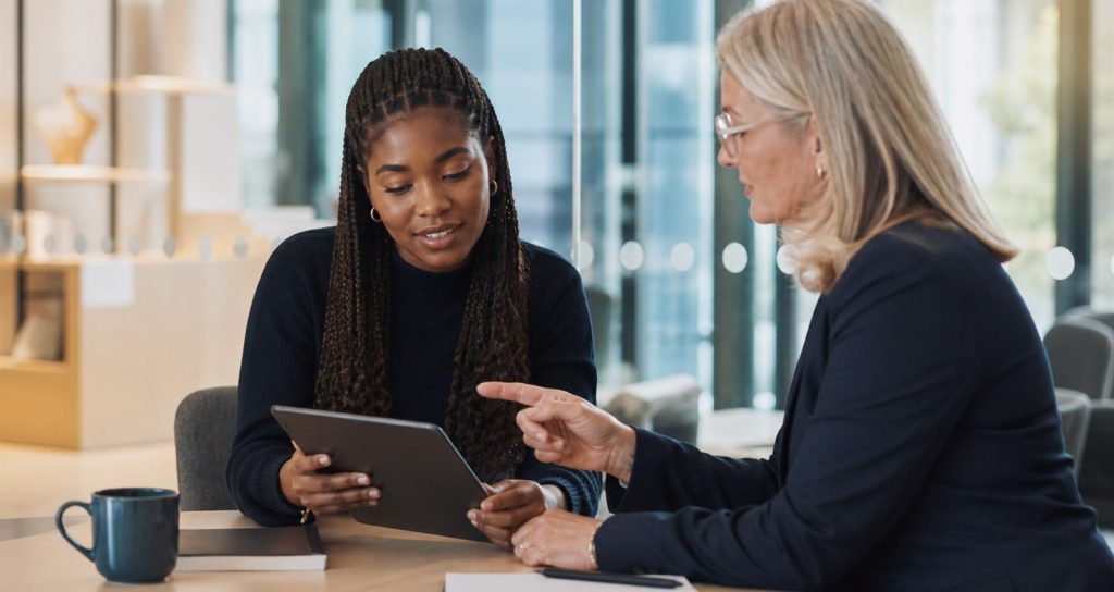 Student reviewing university admission criteria with an academic adviser